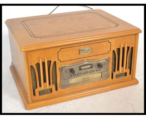 A contemporary 20th Century wooden cased Hi - Fi system modelled as a vintage table top gramophone, fitted with a record play