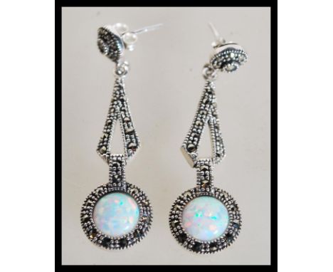 A pair of sterling silver CZ and opal drop earrings set with marcasites in the Art Deco style. Weighs 6 grams. Measures 4cm l