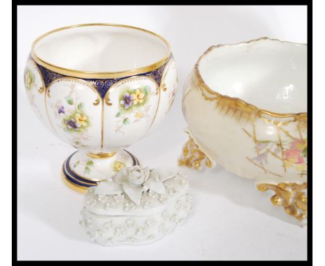 A collection of 19th century porcelain to include a pair of Sitzendorf floral embossed vases of ovoid shape, Blanc de Chine l