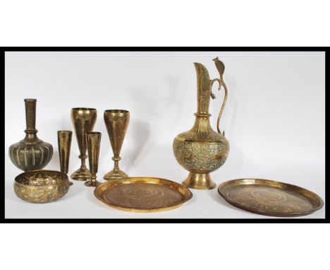 A collection of 20th Century brass wares to include an Indian water jug of bulbous form having intricate engraving of elephan