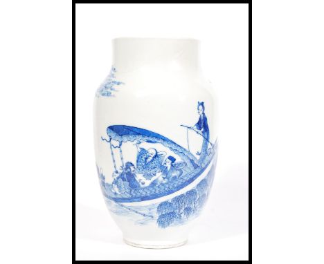 A 19th century blue and white Chinese vase having a tapered neck and rim with hand painted scenes of men playing a betting ga