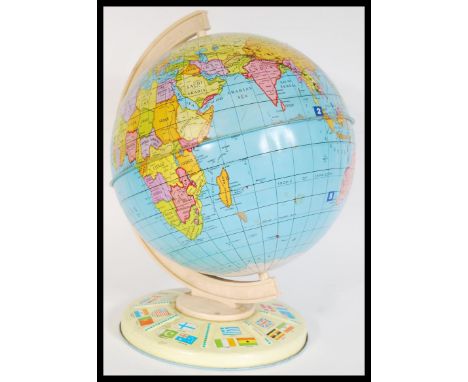 A vintage mid 20th Century Chad Valley tin globe raised on circular base. Measures 32 cm high.