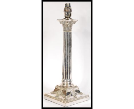 A 19th Century silver plated table lamp in the form of a Classical Corinthian Composite Order column raised on square base de