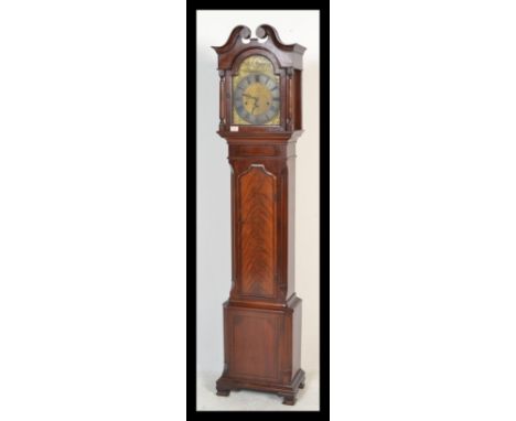 A good Georgian revival mahogany cased longcase / grandfather clock. Surmounted by a swan neck pediment over a brass face wit