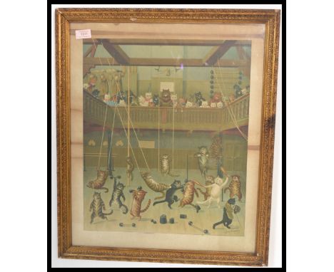 An early 20th Century framed coloured print by Louis Wain depicting cats within a gymnasium, framed and glazed.&nbsp; Measure