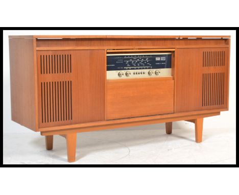 A retro 20th Century teak wood radiogram sideboard, fitted with a Ferguson radio receiver and a Garrard four speed record dec