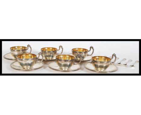 A 20th Century hallmarked Portuguese silver coffee service to include six coffee cups and saucers with shaped handles and dec