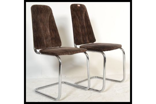 A Pair Of Retro 20th Century Cantilever Dining Chairs Raised On