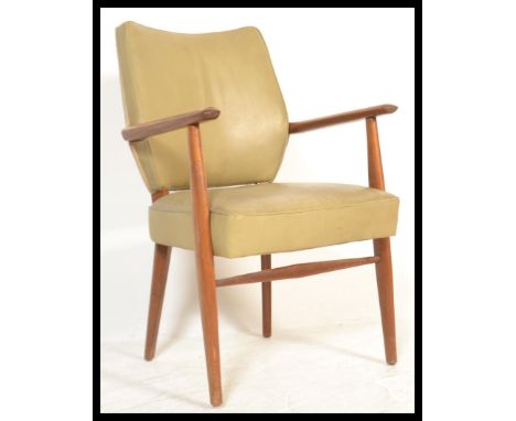 A vintage mid Century Danish open framed elbow armchair / dining chair, shaped elbow rests being raised on turned supports wi