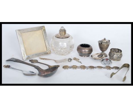 A group of vintage silver and white metal items to include a silver white metal picture frame of square form with rubbed mark