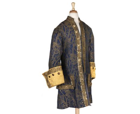 * Theatre Costume. A brocade frock coat and matching breeches, late 19th/early 20th century, handmade coat in blue and gold b