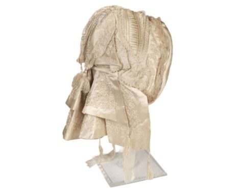 * Garments. A Victorian child's bonnet, hand-made cream silk bonnet, with deep double neck frill, elaborately worked overall 