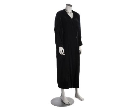 * Garments. A 1930s velvet opera coat, long unstructured black velvet coat, with ruched back, collar, and sleeves, self butto