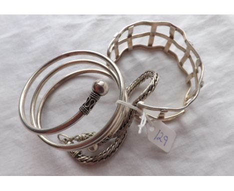Three silver bangle/bracelets 68g     