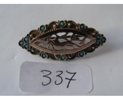 A vintage silver & turquoise stag motif brooch.    