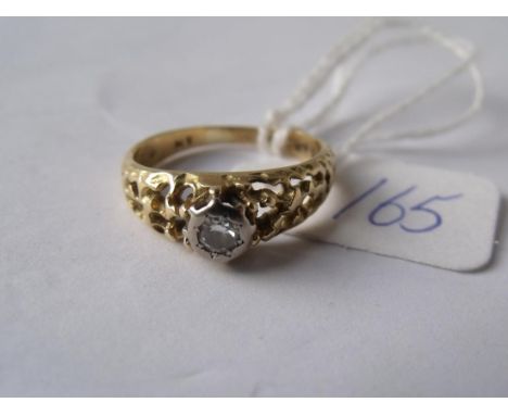A good diamond solitaire in 18ct gold fancy pierced  mount approx size 'K'       