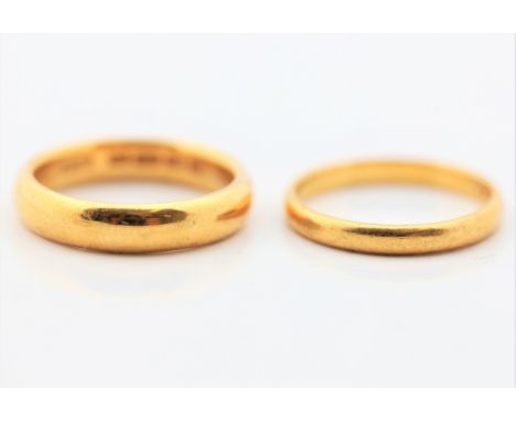 Two hallmarked 22ct yellow gold wedding band rings, ring sizes P-P½, approx. total weight 11.4g.&nbsp;