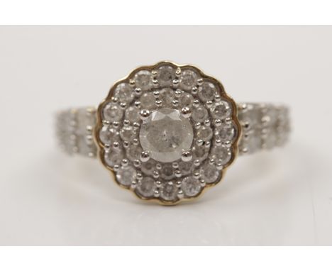 A hallmarked 9ct yellow gold diamond cluster ring, set with a principal round brilliant cut diamond, measuring approx. 0.25ct