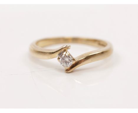 A hallmarked 9ct yellow gold diamond solitaire ring, set with a round brilliant cut diamond, measuring approx. 0.10ct, in cro