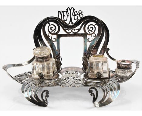 An Empire Plate Art Noveau desk stand housing two inkwells, (A/F).