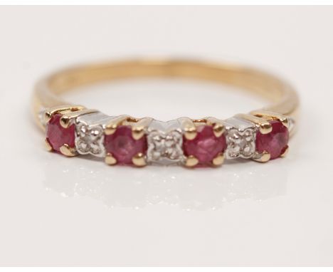 A hallmarked 9ct yellow gold ruby and diamond half eternity ring, set with four round cut rubies each separated by a diamond 