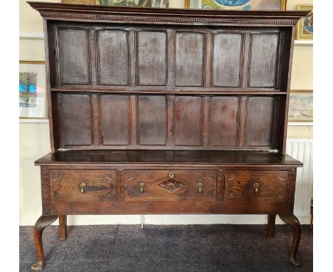 Late 18th century kitchen dresser fitted with three drawers to front on Queen Anne style legs, with a raised shelf plate rack