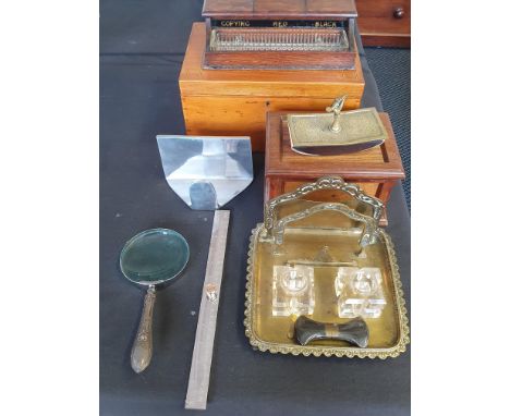 A collection of desk related items to include travel box, ink Wells, and horned-gripped pistol screwdriver.