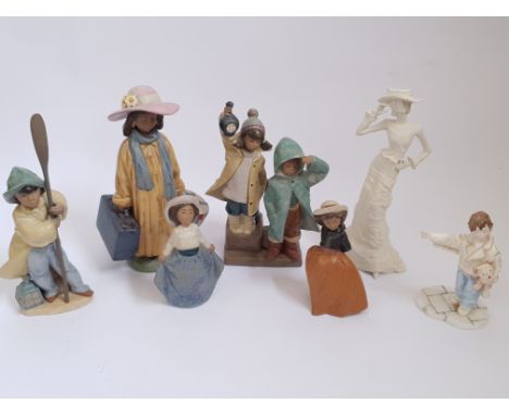 A collection of figurines to include Coalport, Lladro, Nao, and Wedgwood.