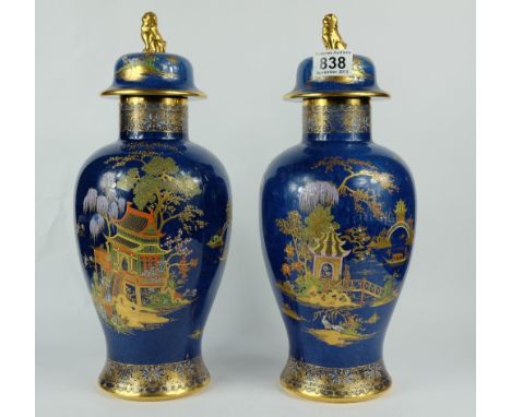 Pair Carltonware vase & covers decorated in the Chinese Pagoda design on blue ground, height 38.5cm  (one has 5cm hairline cr