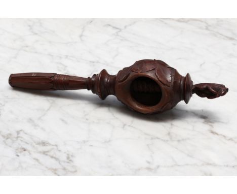 Nutcrackers - a Black Forest novelty screw-action nut cracker, carved with fruiting vine crested by a squirrel, lotus grip, 2