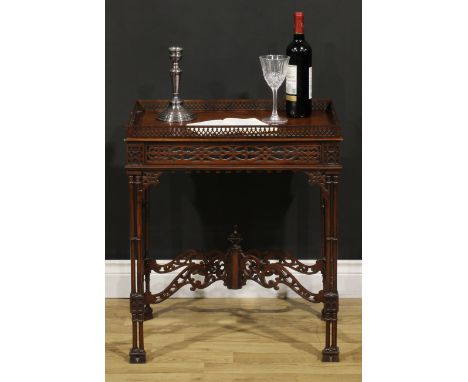 A Chippendale Revival mahogany fretwork and blind fretwork silver table, galleried rectangular top, cluster-column supports, 