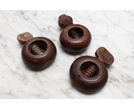 Nutcrackers - a 19th century boxwood ring shaped screw-action pocket nut cracker, 5cm diam; others, similar (3) 