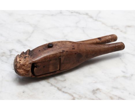Nutcrackers - a late 17th century boxwood lever-action nut cracker, of figural associated type, carved terminal, 13cm long, c