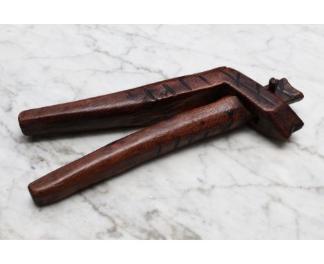 Nutcrackers - a deciduous timber lever-action nut cracker, of simple cross-over construction, pyrography decoration, 21.5cm l