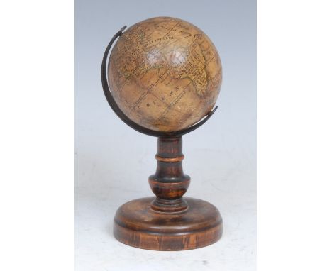 A 19th century miniature terrestrial globe, The Earth, published by J G Klinger, Nuremberg, the printed gores in English, Aus