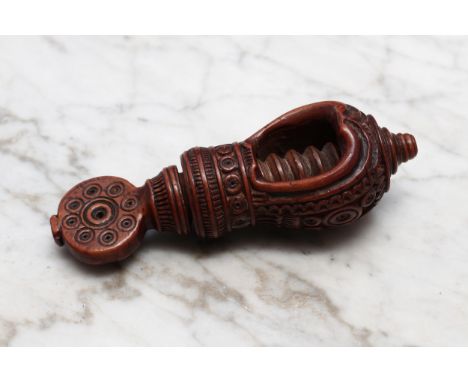 Nutcrackers - a 19th century Swiss acorn shaped screw-action nut cracker, carved with a band of lotus and turned throughout w
