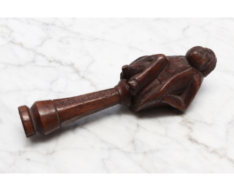 Nutcrackers - a Black Forest novelty screw-action nut cracker, carved in the manner of a coquilla nut snuff box as a gentlema