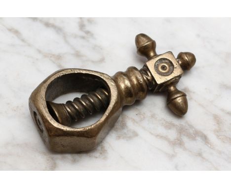 Nutcrackers - an 18th century brass screw-action pocket nut cracker, faceted pear shaped receptacle, cross-form thumbpiece ce