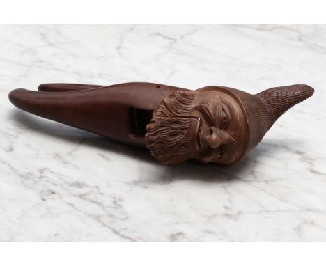 Nutcrackers - a Black Forest novelty lever-action nut cracker, carved as the head of a bearded gnome, 22.5cm long, inscribed 