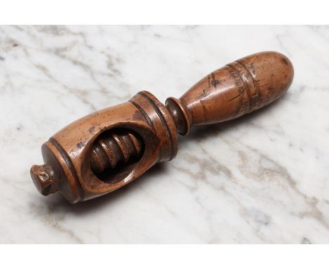 Nutcrackers - a 19th century boxwood screw-action nut cracker, turned handle, 12cm long, c.1840 