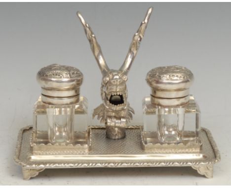 A Chinese silver rectangular inkstand, centred by a deer flanked by a pair of square glass wells, on a ground of dense flower