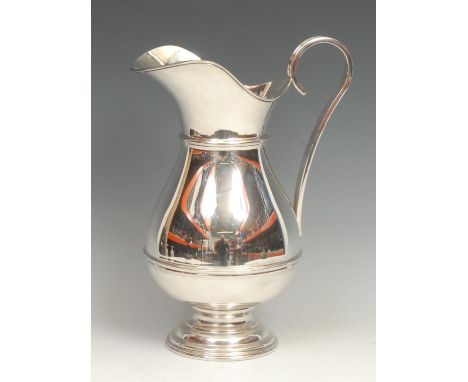 A large Elizabeth II silver beer jug, in 18th century style, quite plain, three-quarter girdle, scroll handle, domed foot, 29