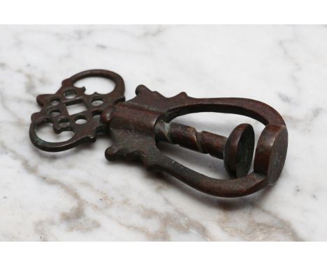 Nutcrackers - a late 17th/early 18th century brass screw-action pocket nut cracker, crown shaped thumb piece, 7.5cm long, c.1