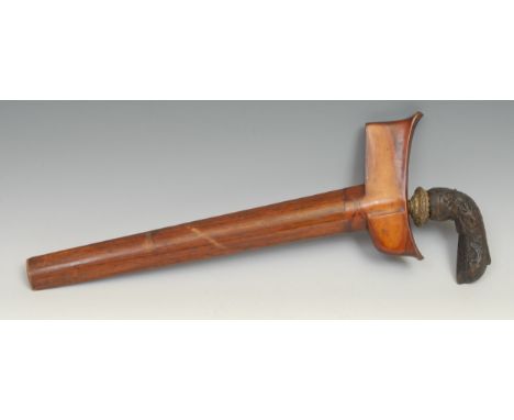 An Indonesian kris, 32cm blade with central ridge, hardwood hulu carved with scrolling lotus, wooden scabbard, 44cm long 