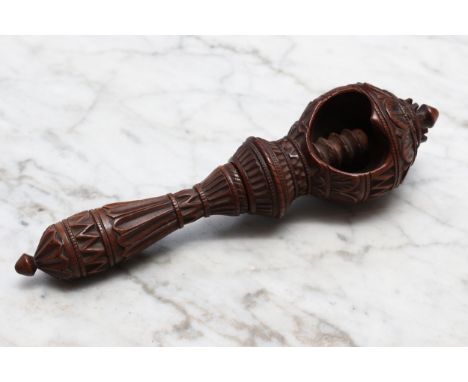 Nutcrackers - a 19th century Swiss acorn shaped screw-action nut cracker, the chamber and haft carved with lotus, inscribed R