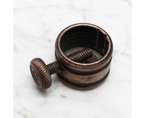 Nutcrackers - a late 18th/early 19th century brass screw-action pocket nut cracker, draught-turned roundel to verso, 3cm diam