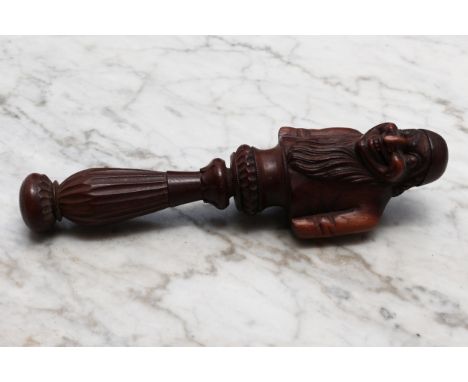 Nutcrackers - a Black Forest novelty screw-action nut cracker, carved as a bearded man, half-length, lotus grip, 18.5cm long,