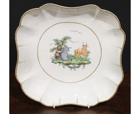 A Worcester Aesop Fable shaped square dish, painted in polychrome with the Bull and the Donkey, osier border, gilt dentil rim