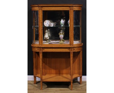 A late 19th century Sheraton Revival satinwood and tulipwood marquetry pier display cabinet, moulded cornice above a glazed d