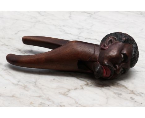 Nutcrackers - a Black Forest novelty lever-action nut cracker, carved and polychrome painted as a gentleman of African herita